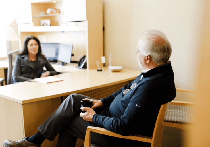 Man and a woman sitting at a desk