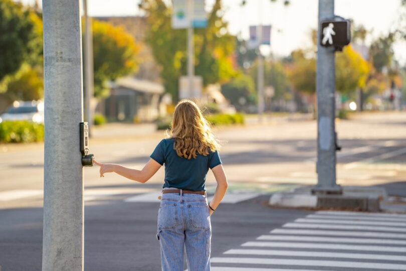 Woman About To Across Street